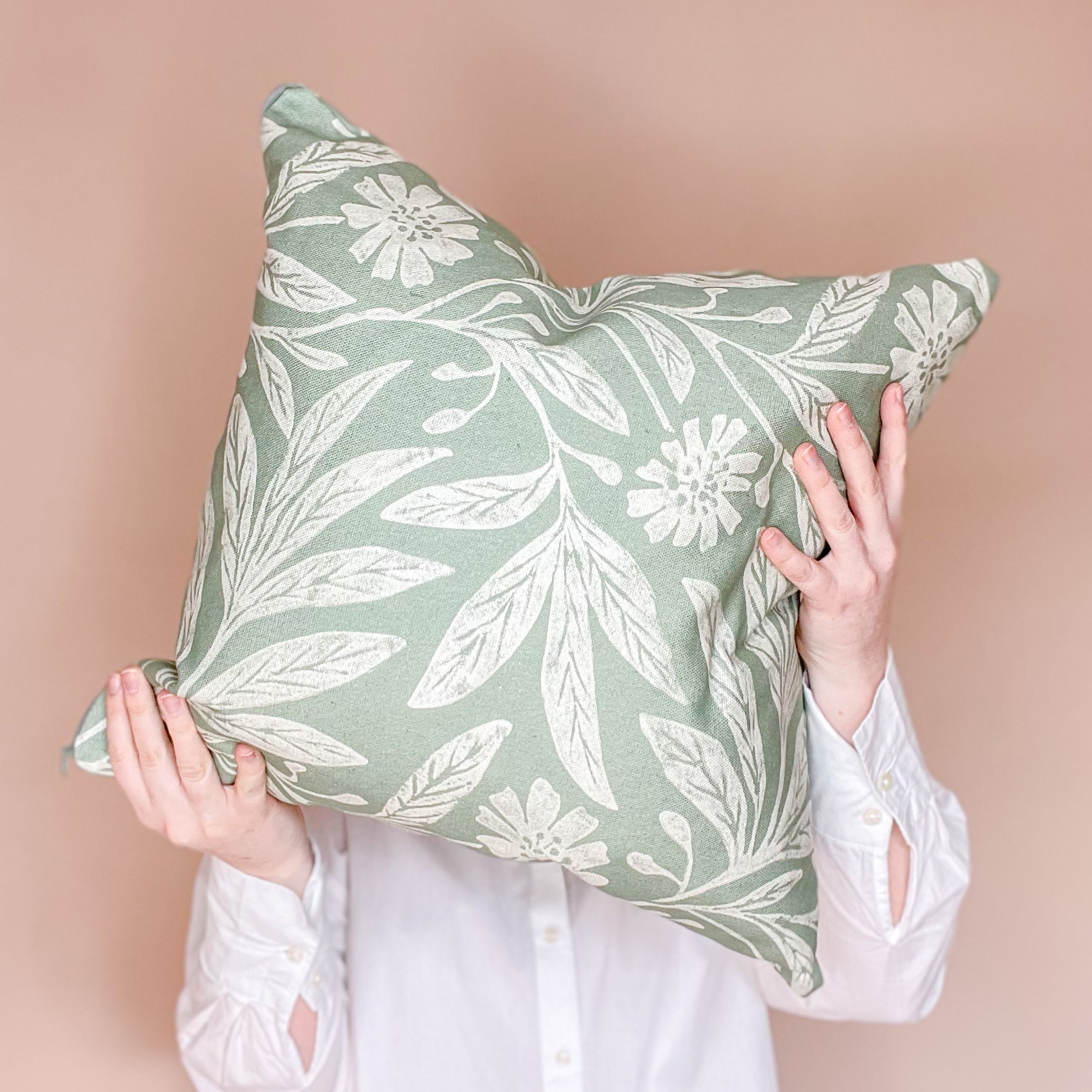 Handmade botanical cushion 'Blooms Big'. Green floral cushion with leafy design.