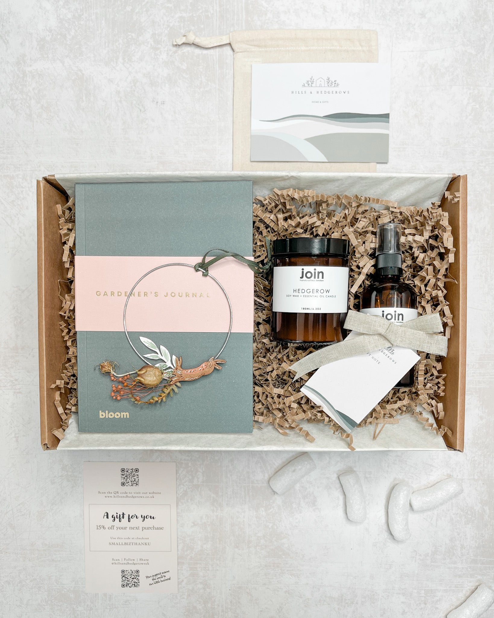 Gift set featuring Gardener's journal, JOIN handcrafted 'hedgerow' room mist, JOIN handcrafted 'hedgerow' candle, and a hare foraged wreath by Lily Faith