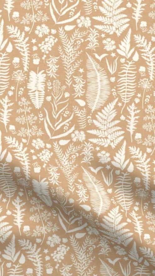 Coppery Ferns fabric designed by Iveta Abolina of One Sweet Orange, featuring intricate fern fronds, wildflowers, and leaves in cream on a copper background, ideal for eco-friendly home decor cushions and lampshades.