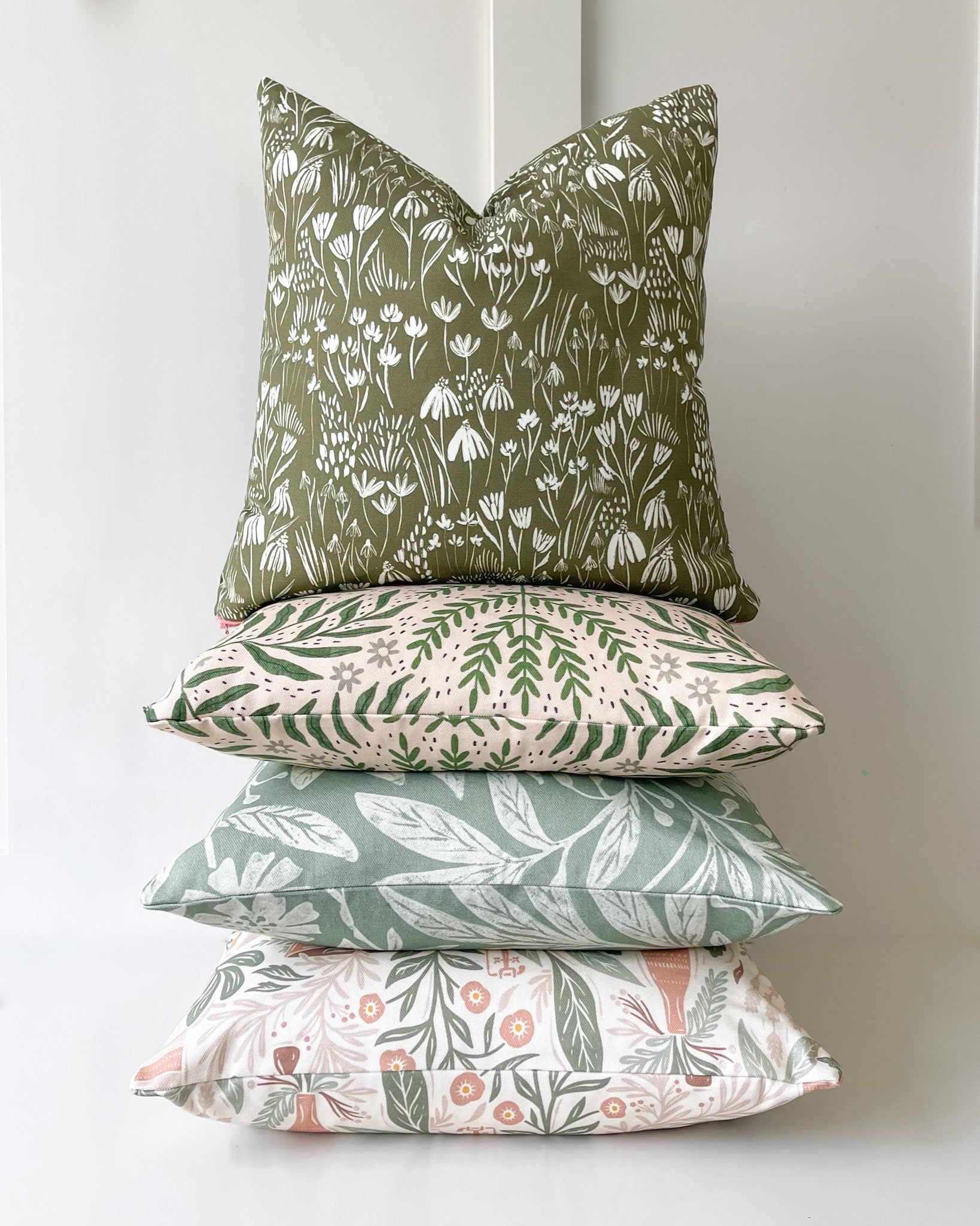 Stacked Decorative Cushions with Nature-spired botanical leafy floral prints. Handmade Scatter Cushions