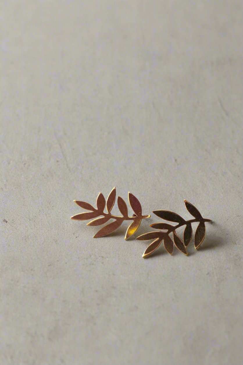 Handcrafted Flutter Leaf Stud Earrings made in the UK with laser-cut brass and hypoallergenic posts. Nature-inspired, lightweight, and gift-ready in a cotton pouch.