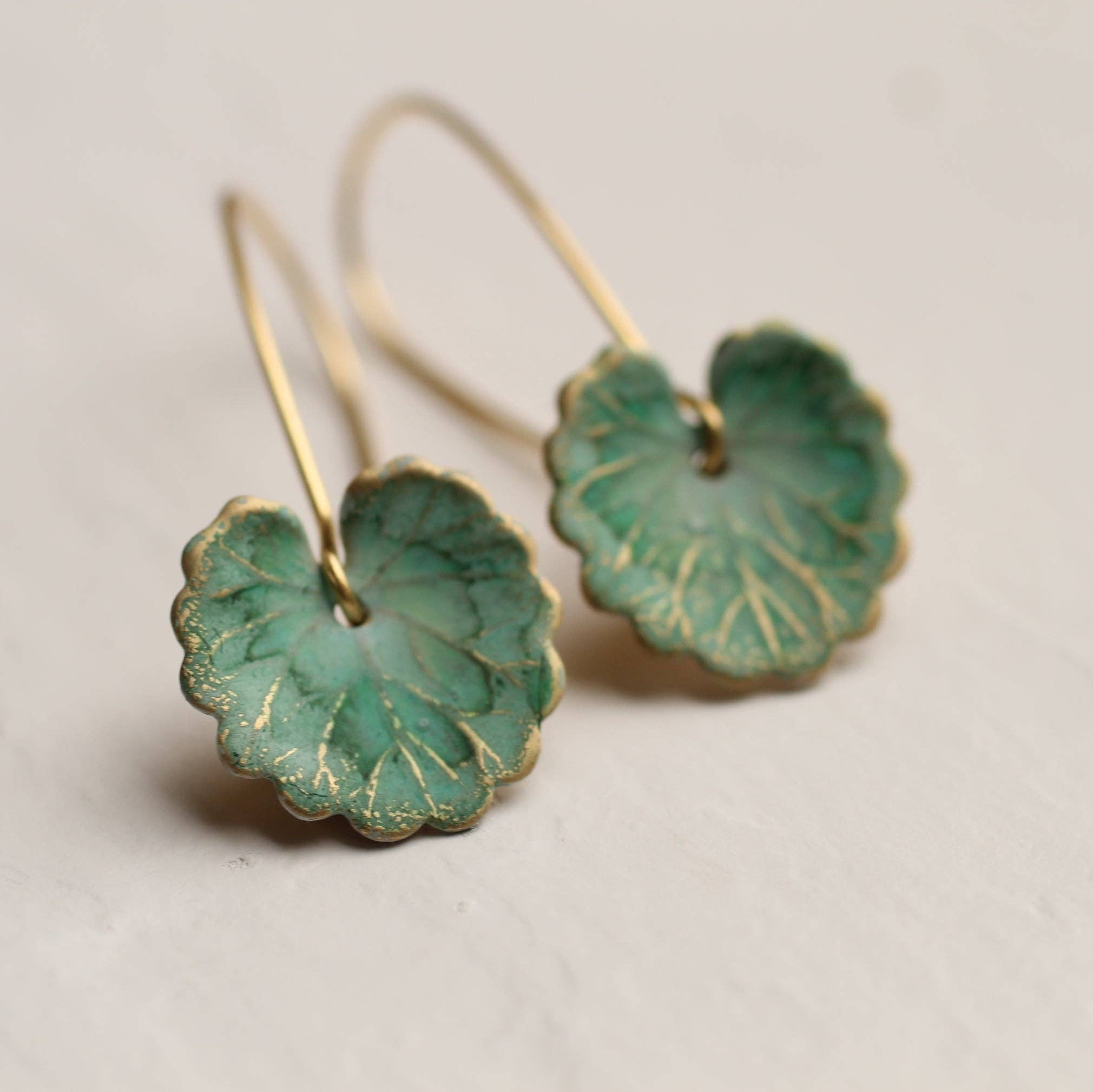 Handcrafted Lily Pad Leaf Earrings, Art Nouveau-inspired. Brass charms with intricate veining, made in Edinburgh. Perfect for autumn and winter, gift-ready in a cotton pouch.