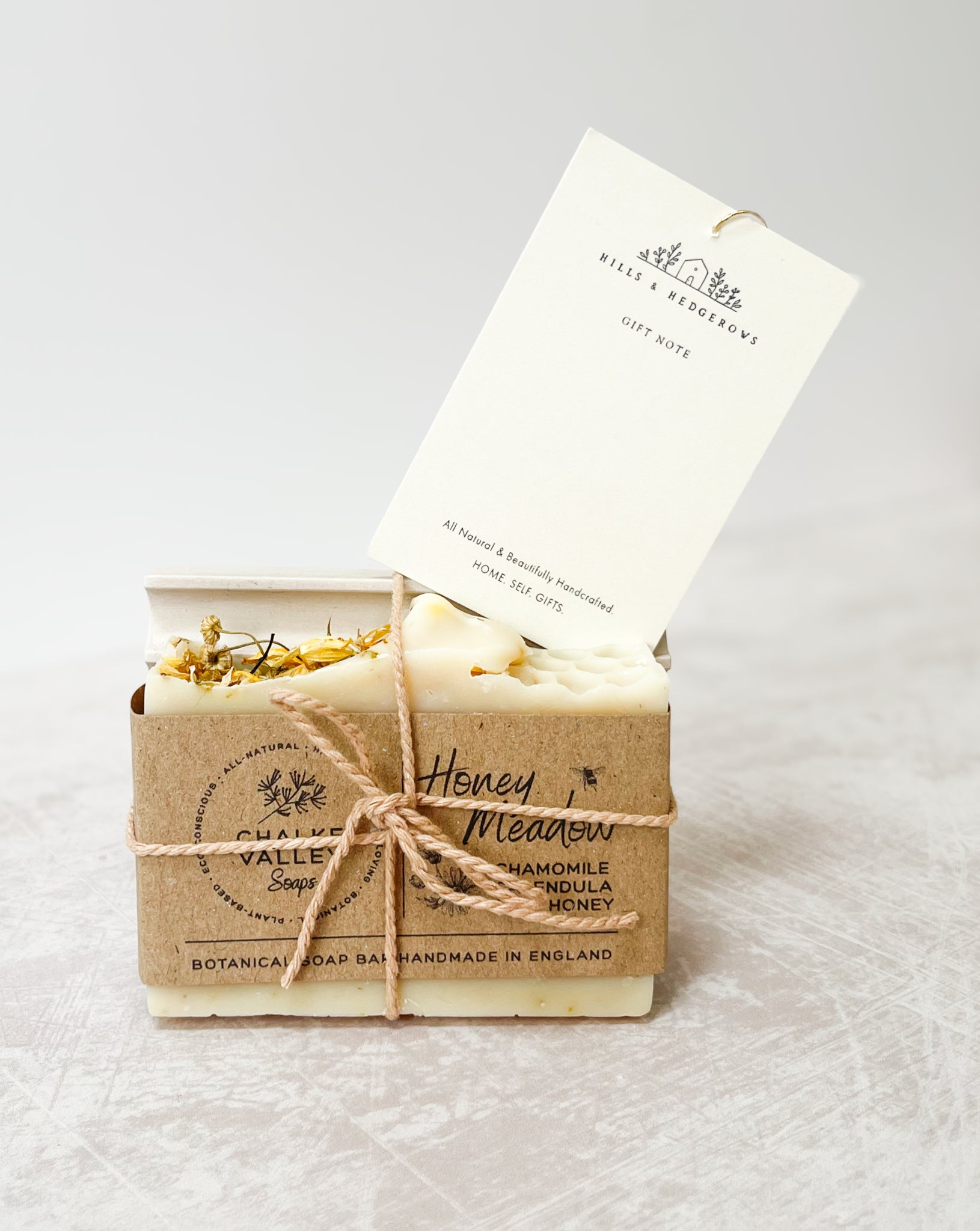 Natural essential oil botanical honey soap bar on neutral soap dish made in the UK With gift note