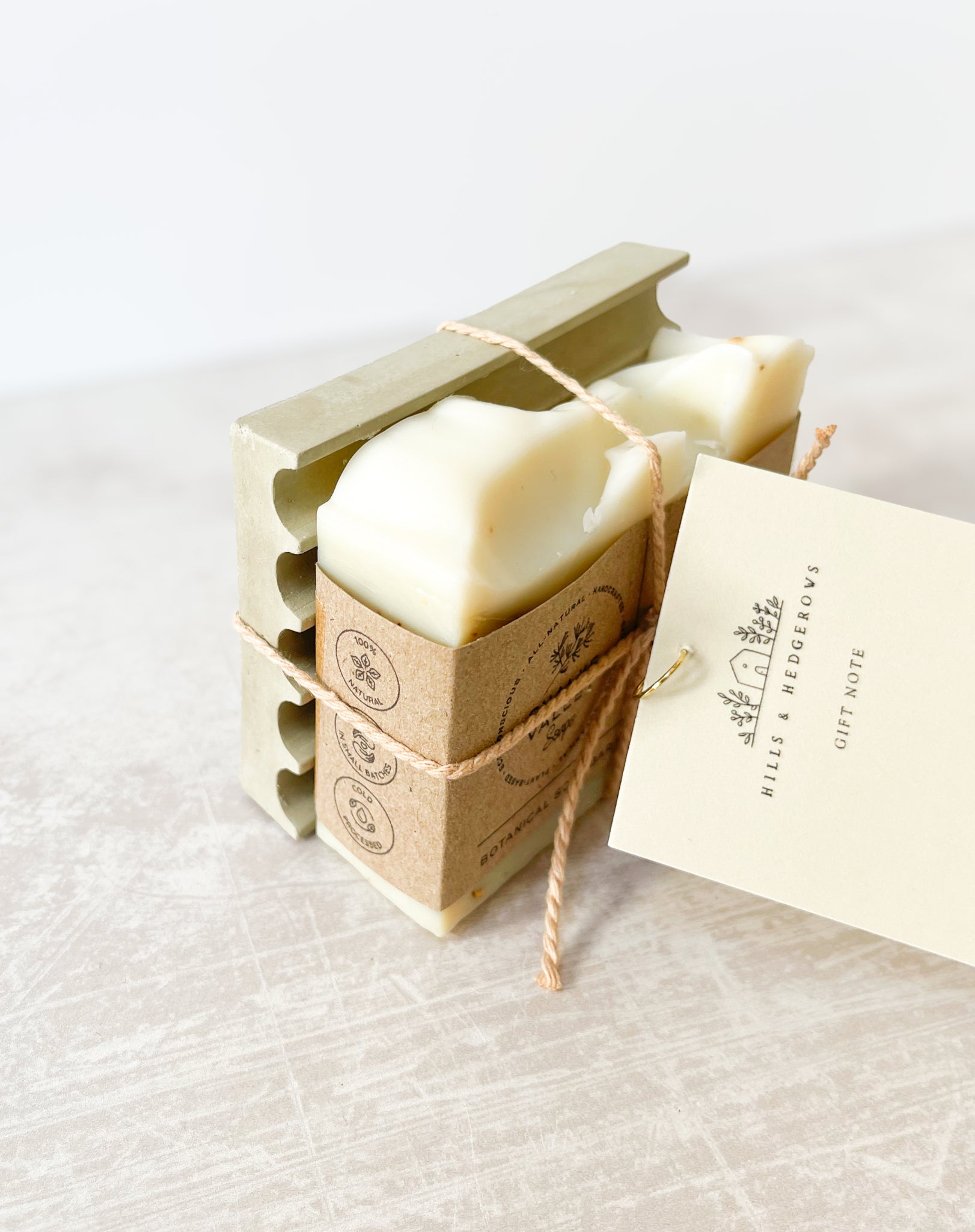 Natural essential oil botanical aromatic soap bar on green soap dish made in the UK With gift note