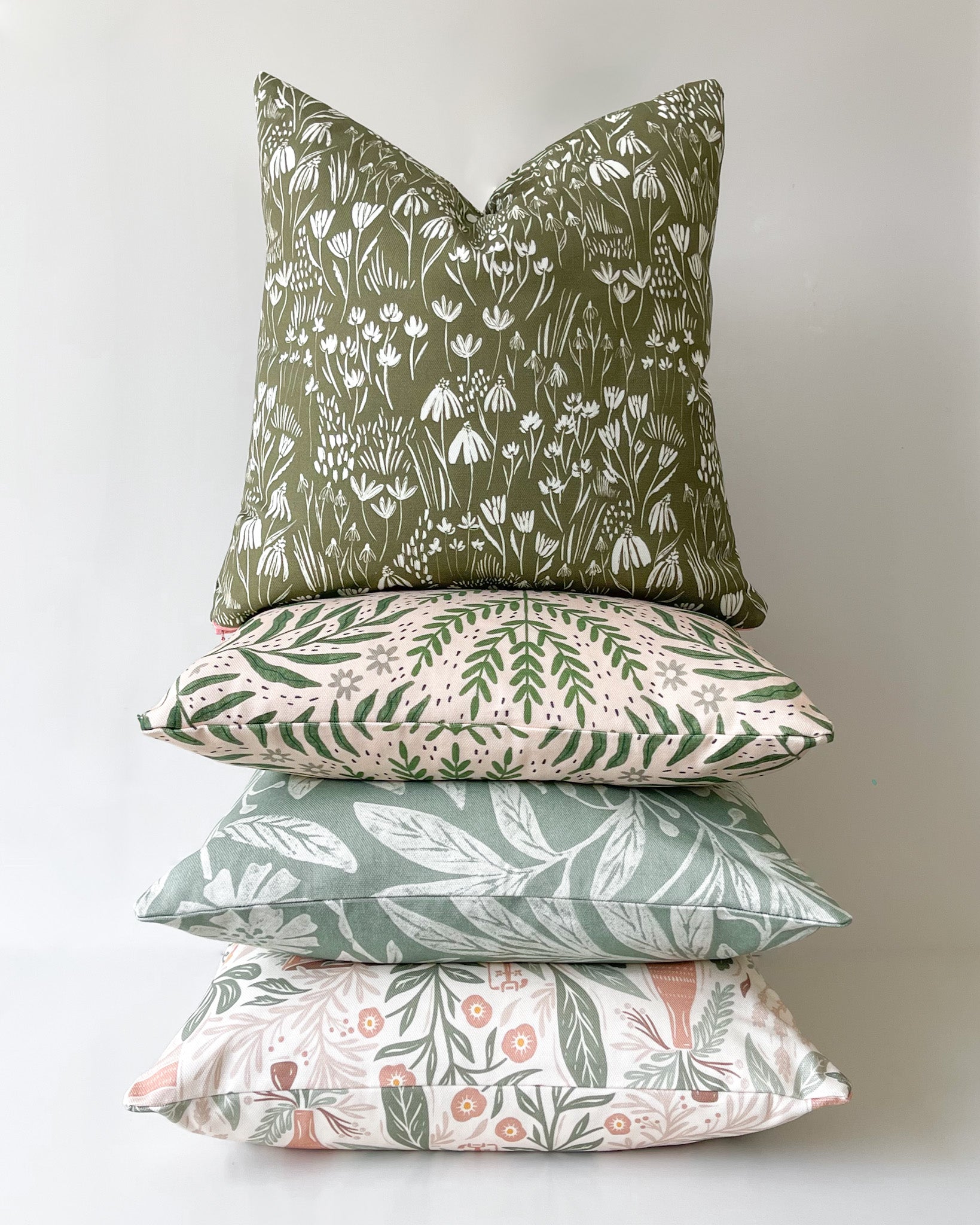 Green floral cushion for decor inspired by nature. Handcrafted cushion in basketweave cotton with a duck feather insert, designed by independent artists.