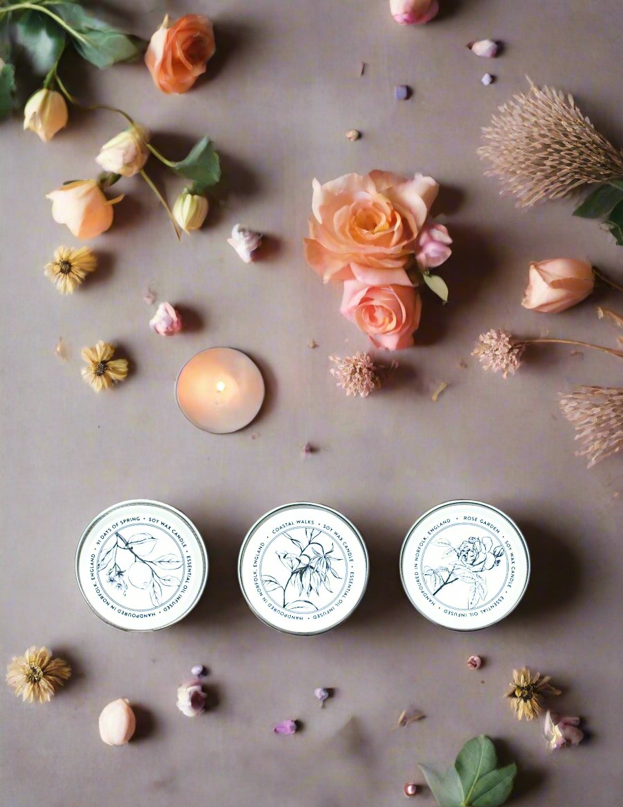 Norfolk Natural Living Mini Candle Trio, featuring three 30g handcrafted soy wax candles with therapeutic scents. Includes Coastal Walks, Rose Garden, and Lavender Fields.