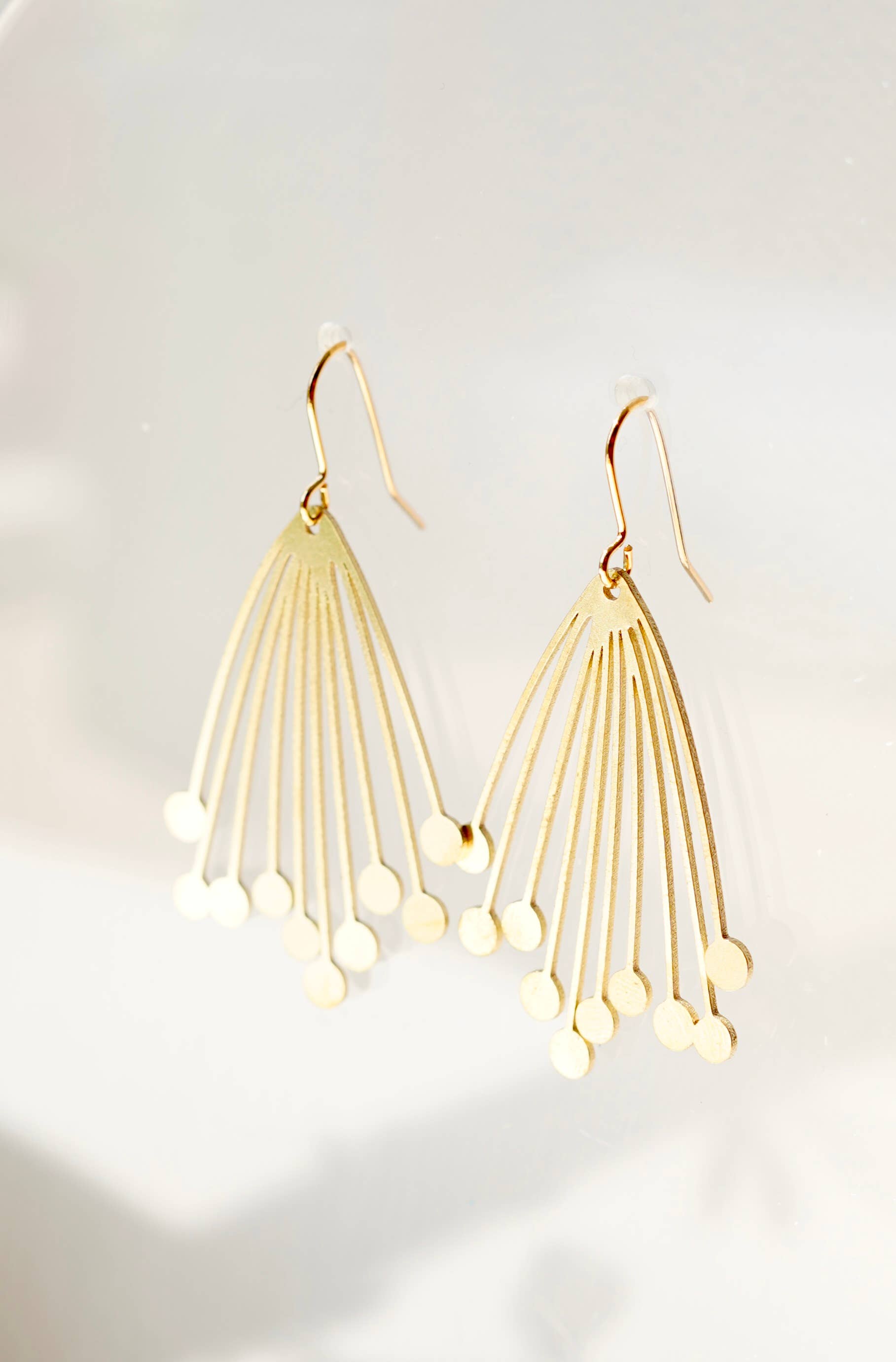 Handcrafted Seed Head Drop Earrings from the Botanical Collection. Made in the UK, featuring a large brass laser-cut design and gold-plated hooks. Ideal for autumn and winter, gift-ready in a cotton pouch.