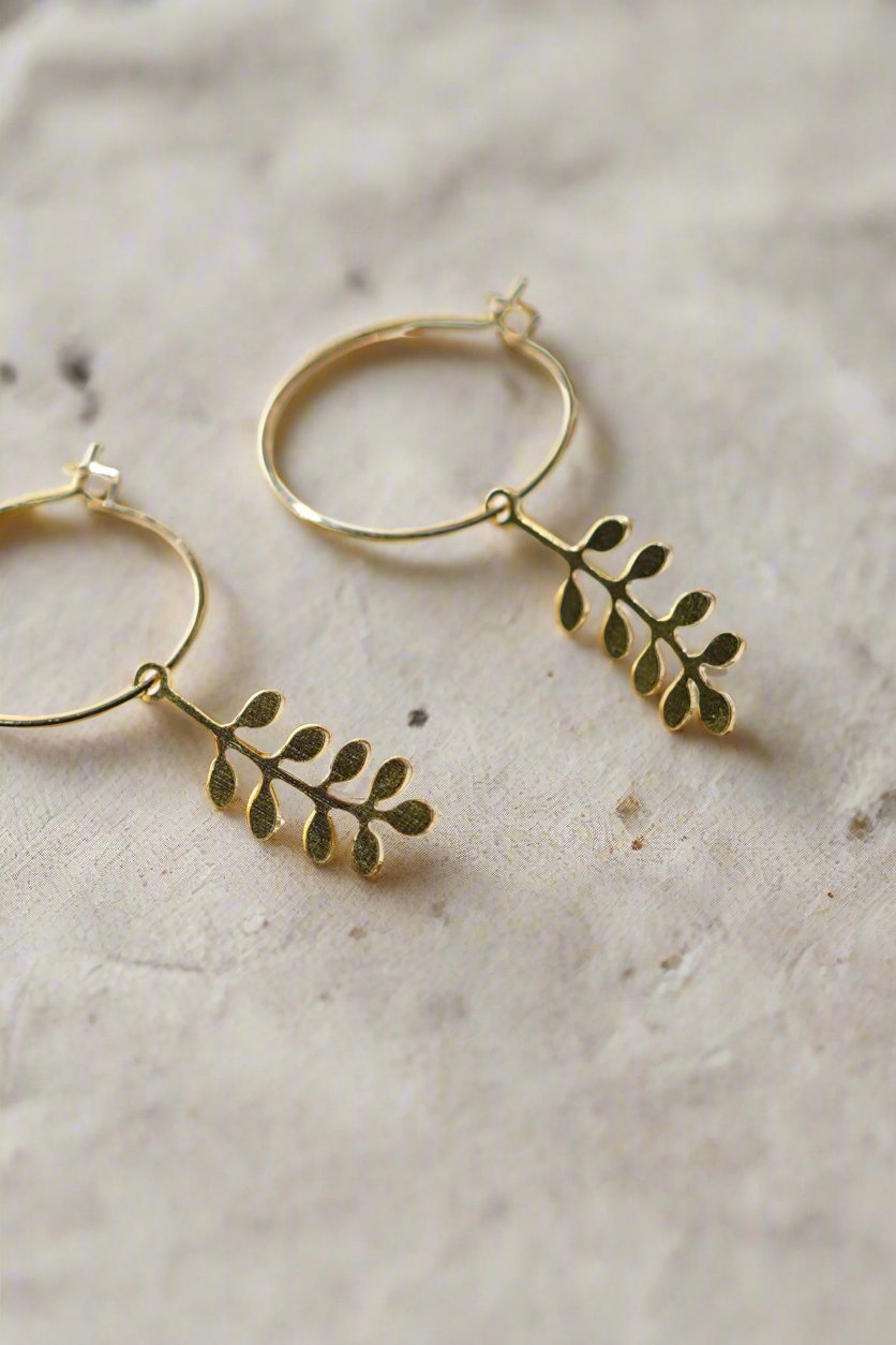 Handcrafted Sprig Hoop Earrings for autumn and winter, made in the UK. Delicate brass sprigs on 20mm gold-plated hoops. Lightweight and gift-ready in a cotton pouch.