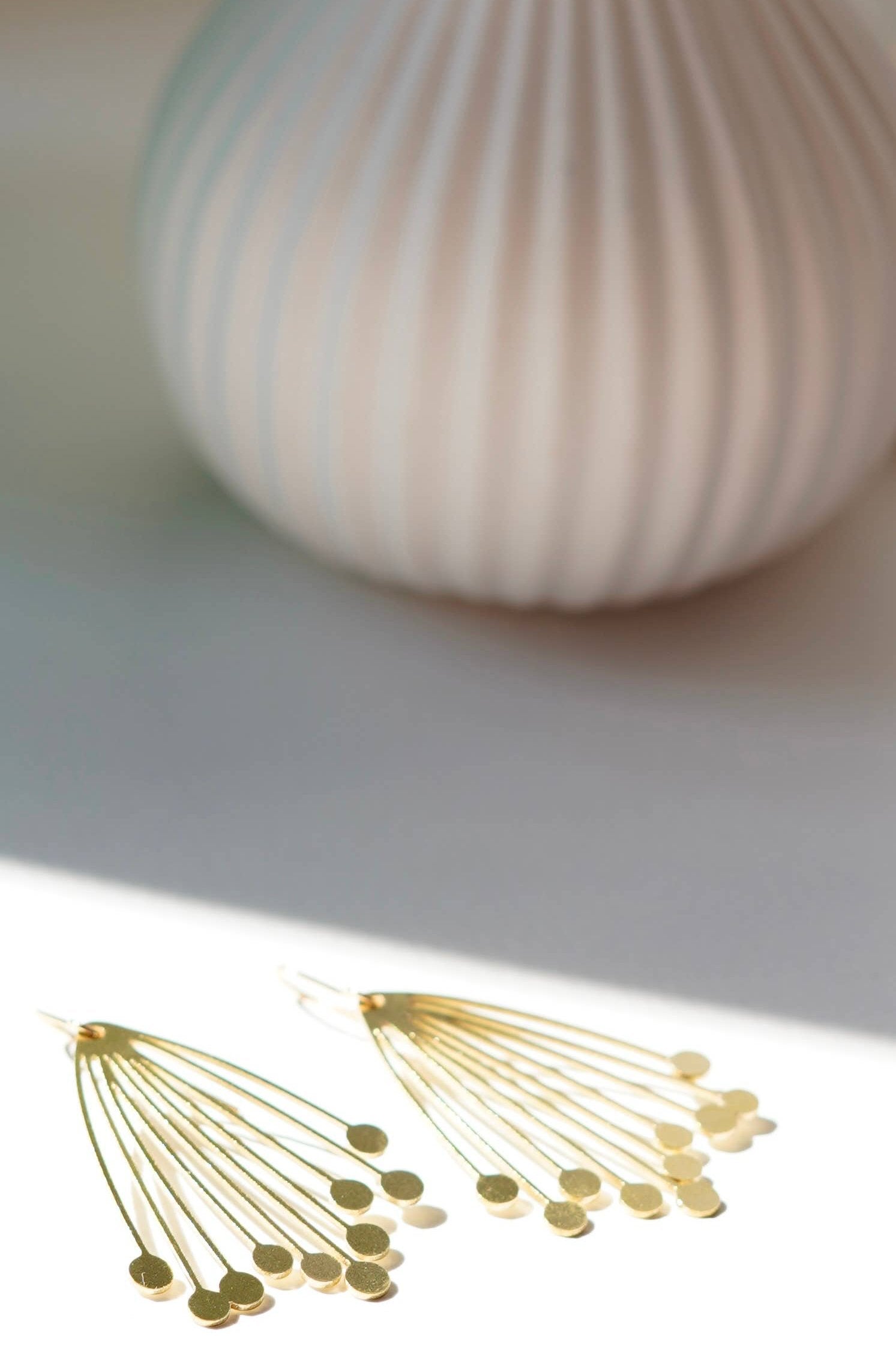 Handcrafted Seed Head Drop Earrings from the Botanical Collection. Made in the UK, featuring a large brass laser-cut design and gold-plated hooks. Ideal for autumn and winter, gift-ready in a cotton pouch.