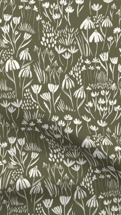 Wildflower Meadow - Forest Green fabric designed by Fleur Crawford of Hufton Studio, featuring white wildflowers on a deep green background, ideal for eco-friendly home decor cushions and lampshades.