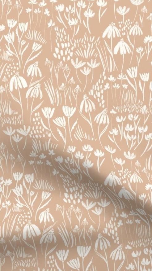 Wildflower Meadow fabric designed by Fleur Crawford of Hufton Studio, featuring white wildflowers on a blush pink background, ideal for eco-friendly home decor cushions and lampshades.