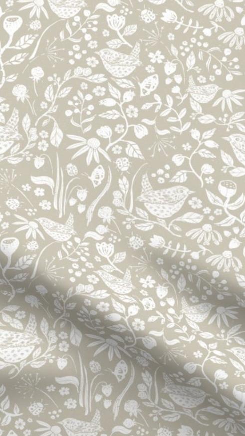 Wren's Hedgerow fabric designed by Kate LaJoie of Wild Spiral Designs, featuring wrens, wildflowers, and leaves in white block print on a taupe background, ideal for eco-friendly home decor cushions and lampshades.